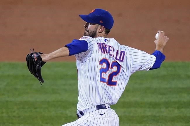 New York Mets starting pitcher Rick Porcello winds up during the third inning of the team's baseball game against the Philadelphia Phillies, Friday, Sept. 4, 2020, in New York. (AP Photo/John Minchillo)
