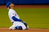 New York Mets shortstop Francisco Lindor reacts after a failed double-play attempt on a ball hit by Arizona Diamondbacks' Zac Gallen during the third inning of a baseball game, Friday, May 7, 2021, in New York. A runner was forced at second, and a run scored. (AP Photo/John Minchillo)