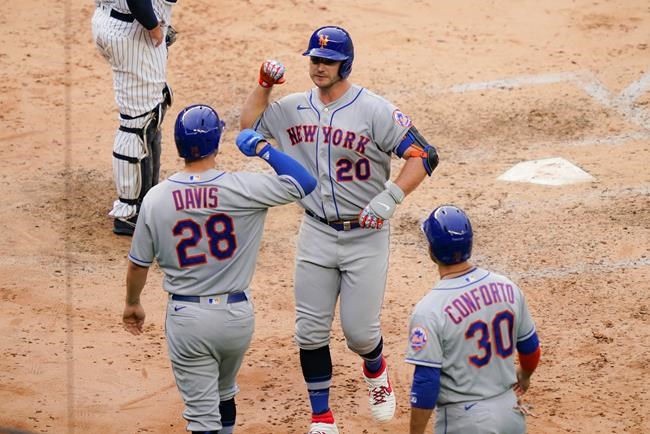 New York Mets' Pete Alonso (20) celebrates with J.D. Davis (28) and Michael Conforto (30) after hitting a tying three-run home run off New York Yankees relief pitcher Chad Green in the sixth inning of the first baseball game of a doubleheader, Friday, Aug. 28, 2020, in New York. (AP Photo/John Minchillo)