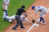 New York Yankees' DJ LeMahieu, center, beats the tag at third by New York Mets third baseman J.D. Davis, right, on a triple hit off starting pitcher Robert Gsellman in the third inning of a baseball game, Saturday, Aug. 29, 2020, in New York. (AP Photo/John Minchillo)