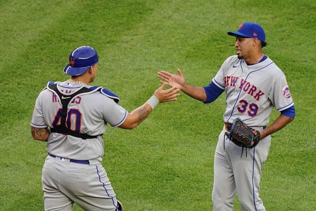 New York Mets relief pitcher Edwin Diaz (39) celebrates with catcher Wilson Ramos (40) after closing the seventh inning of the first baseball game of a doubleheader against the New York Yankees, Friday, Aug. 28, 2020, in New York. (AP Photo/John Minchillo)