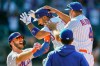 New York Mets' Michael Conforto (30) celebrates after being hit by a pitch and scoring the winning run on loaded bases during the ninth inning of a baseball game against the Miami Marlins, Thursday, April 8, 2021, in New York. (AP Photo/John Minchillo)