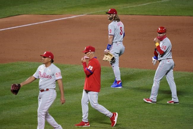 Philadelphia Phillies right fielder Bryce Harper (3) walks to the dugout after being thrown out of the baseball game by umpire Roberto Ortiz during the fifth inning against the New York Mets, Saturday, Sept. 5, 2020, in New York. (AP Photo/John Minchillo)