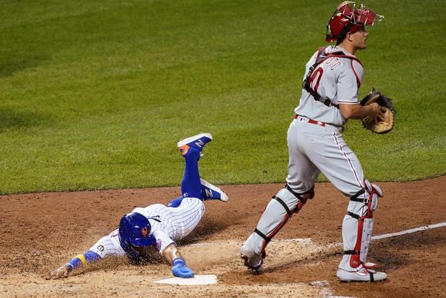 New York Mets' Andres Gimenez scores on a double by Robinson Chirinos off Philadelphia Phillies relief pitcher Ranger Suarez during the sixth inning of a baseball game, Saturday, Sept. 5, 2020, in New York. (AP Photo/John Minchillo)