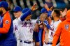 New York Mets' Francisco Lindor (12) celebrates with Patrick Mazeika, center right, who had his jersey removed by his teammates as they celebrate after Pete Alonso scored the winning run against the Arizona Diamondbacks on a grounder by Mazeika in the 10th inning of a baseball game Friday, May 7, 2021, in New York. (AP Photo/John Minchillo)