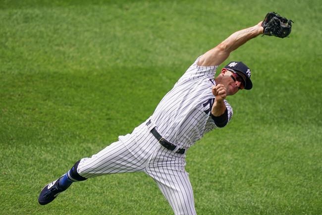 New York Yankees right fielder Mike Tauchman catches a flyout by New York Mets' J.D. Davis in the seventh inning of a baseball game, Saturday, Aug. 29, 2020, in New York. (AP Photo/John Minchillo)