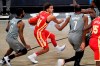 Atlanta Hawks guard Trae Young (11) moves between Brooklyn Nets guard Kyrie Irving (11) and forward Kevin Durant (7) during the first quarter of an NBA basketball game Wednesday, Dec. 30, 2020, in New York. (AP Photo/Kathy Willens)