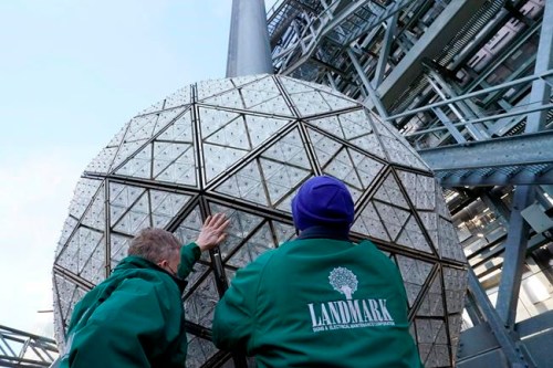 Workers secure a panel of Waterford crystal triangles on the Times Square New Year's Eve ball, Sunday, Dec. 27, 2020, in New York. (AP Photo/Kathy Willens)