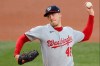 Washington Nationals starting pitcher Patrick Corbin (46) winds up during the first inning of a baseball game against the New York Mets, Monday, Aug. 10, 2020, in New York. (AP Photo/Kathy Willens)