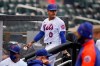 New York Mets starting pitcher Marcus Stroman leaves the field at the start of a rain delay during the first inning of a baseball game against the Miami Marlins at Citi Field, Sunday, April 11, 2021, in New York. The game was delayed at the top of the first inning due to rain. (AP Photo/Seth Wenig)