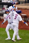 New York Mets' Tomás Nido, right, celebrates his two-run homer with Dominic Smith during the fourth inning of a baseball game against the Washington Nationals at Citi Field, Thursday, Aug. 13, 2020, in New York. (AP Photo/Seth Wenig)