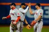 Boston Red Sox's Xander Bogaerts, center, celebrates with Hunter Renfroe, right, and Alex Verdugo after of a baseball game against the New York Mets Wednesday, April 28, 2021, in New York. The Red Sox won 1-0. (AP Photo/Frank Franklin II)