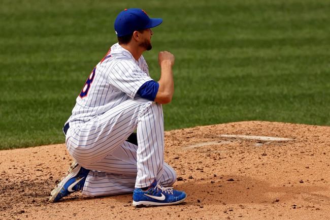 New York Mets pitcher Jacob deGrom reacts after giving up an RBI single to Miami Marlins' Lewin Diaz during the sixth inning of a baseball game on Monday, Aug. 31, 2020, in New York. (AP Photo/Adam Hunger)