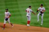 Washington Nationals' Victor Robles (16) celebrates with teammates Starlin Castro (14) and Juan Soto (22) after a baseball game against the New York Mets Tuesday, Aug. 11, 2020, in New York. The Nationals won 2-1. (AP Photo/Frank Franklin II)