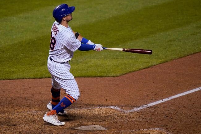 New York Mets' J.D. Davis watches his game-tying solo home run during the ninth inning of the team's baseball game against the New York Yankees on Thursday, Sept. 3, 2020, in New York. (AP Photo/Kathy Willens)