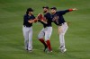 Boston Red Sox outfielders' Alex Verdugo, right, Kevin Pillar, center, and Andrew Benintendi celebrate after the baseball game against the New York Mets at Citi Field, Thursday, July 30, 2020, in New York. The Red Sox defeated the Mets 4-2. (AP Photo/Seth Wenig)