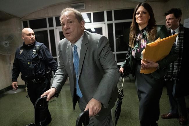 Harvey Weinstein leaves a Manhattan courthouse followed by his his lead attorney Donna Rotunno in the first day of jury deliberations in his rape trial, Tuesday, Feb. 18, 2020, in New York. (AP Photo/Mary Altaffer)