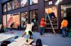 Workers board up windows of a Nespresso store, Monday, June 1, 2020, in the SoHo neighbourhood of New York. Protesters broke into the store Sunday night in reaction to George Floyd's death while in police custody on May 25 in Minneapolis. (AP Photo/Mark Lennihan)