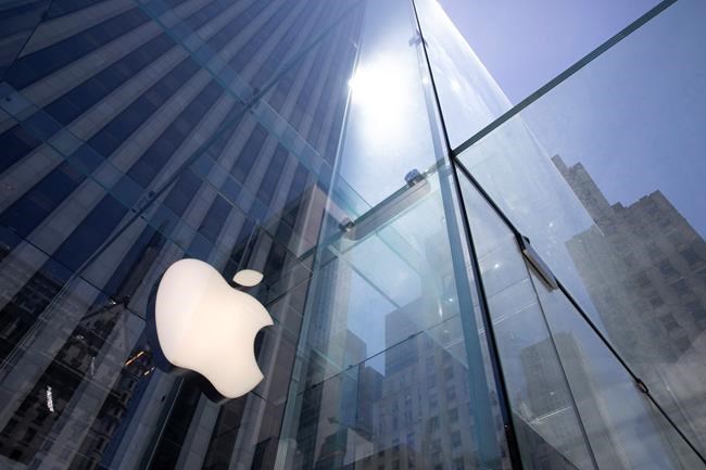 Apple's Fifth Avenue store remains closed during the coronavirus pandemic, Tuesday, June 16, 2020, in New York. U.S. retail sales jumped by a record 17.7% from April to May, with spending partially rebounding after the coronavirus had shut down businesses, flattened the economy and paralyzed consumers during the previous two months. (AP Photo/Mark Lennihan)