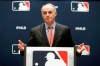 FILE - In this Nov. 21, 2019, file photo, baseball commissioner Rob Manfred speaks to the media at the owners meeting in Arlington, Texas. Major League Baseball is cutting the salary of senior staff by an average of 35% for this year and is guaranteeing paychecks to its full-time employees of its central office through May. Baseball Commissioner Rob Manfred made the announcement Tuesday, April 14, 2020. (AP Photo/LM Otero, File)