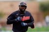 FILE - In this Friday, Feb. 28, 2020 file photo, Cleveland Indians' Franmil Reyes reacts after hitting a home run during the second inning of a spring training baseball game against the Chicago White Sox in Glendale, Ariz. Franmil Reyes' first error this season was in judgment. The Indians' free-swinging slugger and outfielder apologized Thursday, July 9, 2020 for endangering his health and his teammates' for not wearing a mask while attending a holiday party last weekend. (AP Photo/Gregory Bull, File)