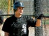 FILE - In this Thursday, Feb. 25, 2010 file photo, Chicago White Sox shortstop Omar Vizquel watches practice on an adjacent field during baseball spring training practice in Glendale, Ariz. Longtime major league shortstop Omar Vizquel is denying accusations of domestic abuse made by his wife after she described two alleged acts of physical violence by the 11-time Gold Glove winner in a story published by The Athletic. Blanca Vizquel, 36, said her 53-year-old husband first assaulted her in 2011, three years before they married, and again in 2016. (AP Photo/Mark Duncan, File)