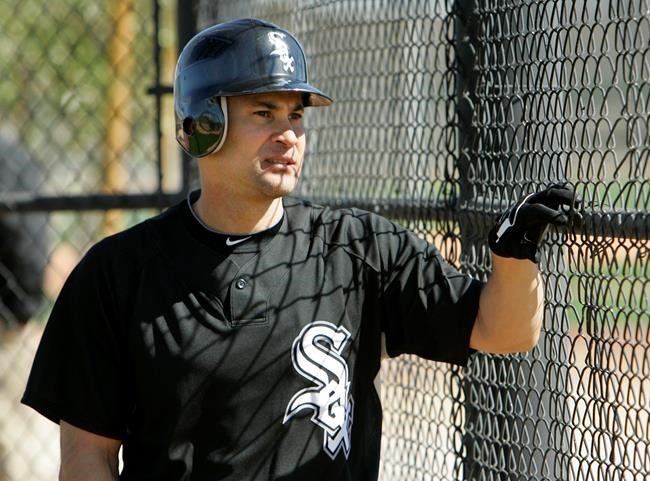 FILE - In this Thursday, Feb. 25, 2010 file photo, Chicago White Sox shortstop Omar Vizquel watches practice on an adjacent field during baseball spring training practice in Glendale, Ariz. Longtime major league shortstop Omar Vizquel is denying accusations of domestic abuse made by his wife after she described two alleged acts of physical violence by the 11-time Gold Glove winner in a story published by The Athletic. Blanca Vizquel, 36, said her 53-year-old husband first assaulted her in 2011, three years before they married, and again in 2016. (AP Photo/Mark Duncan, File)