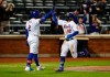 New York Mets' Francisco Lindor (12) is congratulated by Dominic Smith (2) after scoring against the Arizona Diamondbacks during the third inning of a baseball game Saturday, May 8, 2021, in New York. (AP Photo/Noah K. Murray)