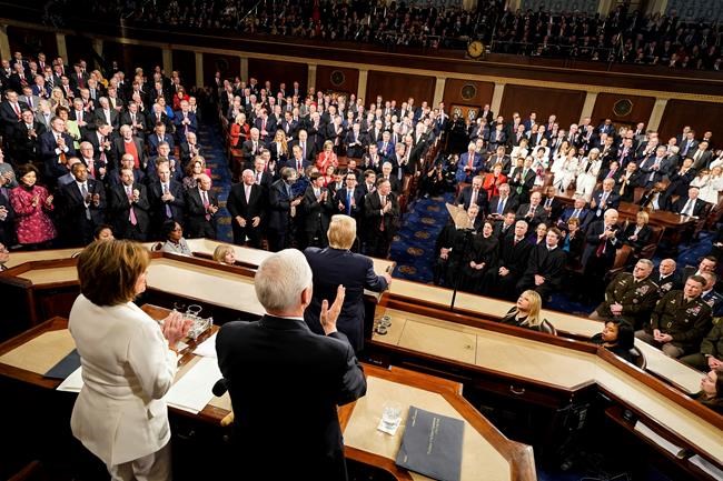 President Donald Trump delivers his State of the Union address to a joint session of Congress on Capitol Hill in Washington, Tuesday, Feb. 4, 2020, as House Speaker Nancy Pelosi of Calif., left, and Vice President Mike Pence watch. (Doug Mills/The New York Times via AP, Pool)