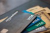 FILE - This Aug. 11, 2019 file photo shows credit cards in New Orleans. U.S. consumer borrowing fell in March for the first time in more than eight years, with the category covering credit cards dropping by the largest amount in over three decades, the Federal Reserve reported Thursday, May 7, 2020. (AP Photo/Jenny Kane, file)