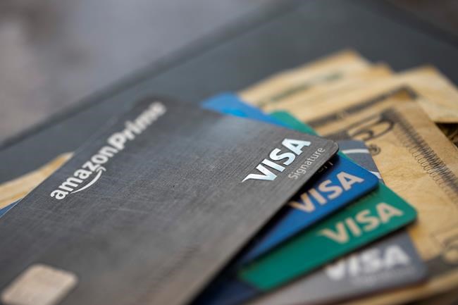 FILE - This Aug. 11, 2019 file photo shows credit cards in New Orleans. U.S. consumer borrowing fell in March for the first time in more than eight years, with the category covering credit cards dropping by the largest amount in over three decades, the Federal Reserve reported Thursday, May 7, 2020. (AP Photo/Jenny Kane, file)