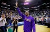 FILE - In this March 28, 2016, file photo, Los Angeles Lakers forward Kobe Bryant waves to the fans after his introduction before the start of the first quarter of an NBA basketball game against the Utah Jazz, in Salt Lake City. Bryant, the 18-time NBA All-Star who won five championships and became one of the greatest basketball players of his generation during a 20-year career with the Los Angeles Lakers, died in a helicopter crash Sunday, Jan. 26, 2020. He was 41. (AP Photo/Rick Bowmer, File)