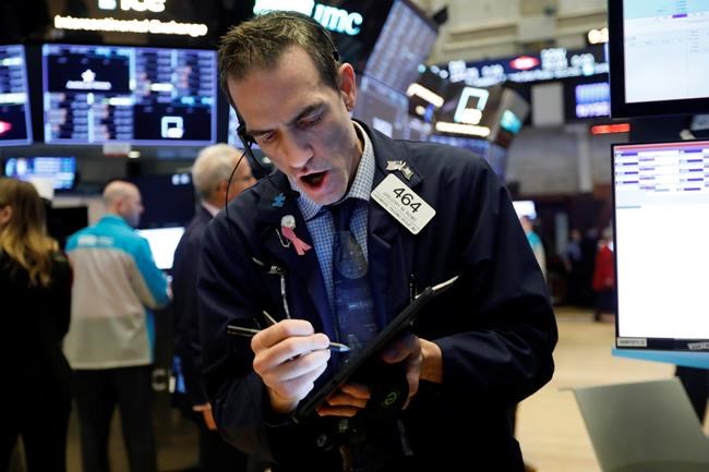 Trader Gregory Rowe works on the floor of the New York Stock Exchange, Tuesday, March 10, 2020. Stocks, Treasury yields and oil are clawing back some of the plunge they took a day before, when the S&P 500 had its worst drop in more than a decade. (AP Photo/Richard Drew)
