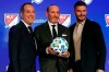 Inter Miami CF co-owners Jorge Mas, left, and David Beckham, right, pose for photos with Major League Soccer Commissioner Don Garber during the Major League Soccer 25th Season kickoff event, New York, Wednesday, Feb. 26, 2020. (AP Photo/Richard Drew)