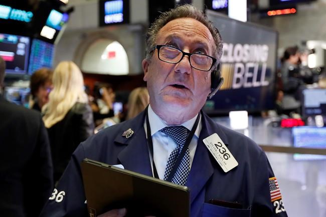 Trader Steven Kaplan watches the numbers at the closing bell on the floor of the New York Stock Exchange, Monday, March 2, 2020. The Dow Jones Industrial Average surged more than 1,200 points, or 5%, on hopes that central banks will take action to shelter the global economy from the effects of the coronavirus outbreak. (AP Photo/Richard Drew)