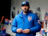 FILE - In this Sunday, April 28, 2019, file photo, then-New York Mets manager Mickey Callaway stands by the dugout before a baseball game against the Milwaukee Brewers at Citi Field, in New York. Callaway, former manager of the New York Mets and current Los Angeles Angels pitching coach, “aggressively pursued” several women who work in sports media and sent three of them inappropriate photos, The Athletic reported Monday, Feb. 1, 2021. (AP Photo/Seth Wenig, File)