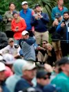 FILE - In this Sunday, March 17, 2019, file photo, Rory McIlroy, of Northern Ireland, tees off on the 15th hole during the final round of The Players Championship golf tournament in Ponte Vedra Beach, Fla. McIlroy doesn't believe he'll play as well without fans at a tournament, amid the coronavirus pandemic. (AP Photo/Lynne Sladky, File)