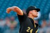 FILE - In this Tuesday, Aug. 20, 2019, file photo, Pittsburgh Pirates starter Chris Archer pitches against the Washington Nationals in the first inning of a baseball game, in Pittsburgh. Free agent right-hander Archer has finalized a one-year, $6.5 million contract that reunites him with the Tampa Bay Rays. The 32-year-old is back with the AL champions after missing all of the pandemic-shortened 2020 season after having surgery to relieve symptoms of neurogenic thoracic outlet syndrome when he was with the Pittsburgh Pirates. (AP Photo/Keith Srakocic, File)