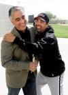 FILE - In this Saturday, Feb. 16, 2008, file photo, Chicago White Sox manager Ozzie Guillen, right, jokes with ESPN's Pedro Gomez after a news conference during the first day of baseball spring training for pitchers and catchers, in Tucson, Ariz. Gomez, a longtime baseball correspondent for ESPN who covered more than 25 World Series, died Sunday, Feb. 7, 2021. He was 58. (AP Photo/M. Spencer Green, File)