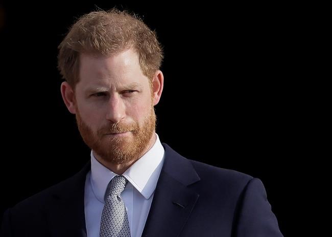 FILE - In this Thursday, Jan. 16, 2020, file photo, Britain's Prince Harry arrives in the gardens of Buckingham Palace in London. Prince Harry said Sunday, Jan. 19 that he felt “great sadness” but found “no other option” to cutting almost all of his and his wife Meghan’s royal ties in the hopes of achieving a more peaceful life. (AP Photo/Kirsty Wigglesworth, File)