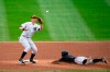 File-This Sept. 26, 2020, file photo shows Miami Marlins' Jon Berti stealing second base as New York Yankees second baseman DJ LeMahieu waits for the throw during the third inning of a baseball game at Yankee Stadium in New York. Houston Astros outfielder George Springer, LeMahieu, and Philadelphia catcher J.T. Realmuto were among just six free agents who received $18.9 million qualifying offers on Sunday, Nov. 1, 2020, from their former teams. Three right-handed pitchers also received the offers, Cincinnati‚Äôs Trevor Bauer, the New York Mets‚Äô Marcus Stroman, and San Francisco's Kevin Gausman. (AP Photo/Corey Sipkin, File)
