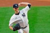 New York Yankees starting pitcher J.A. Happ winds up during the first inning of a baseball game against the Boston Red Sox, Sunday, Aug. 16, 2020, in New York. (AP Photo/Kathy Willens)