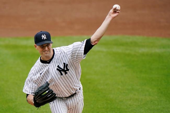 New York Yankees starting pitcher J.A. Happ delivers during the first inning of a baseball game against the Baltimore Orioles, Sunday, Sept. 13, 2020, at Yankee Stadium in New York. (AP Photo/Kathy Willens)