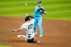 Toronto Blue Jays' Joe Panik throws out New York Yankees' Gleyber Torres at first base after forcing out Giancarlo Stanton, left, on a double play during the first inning of a baseball game Thursday, Sept. 17, 2020, in New York. (AP Photo/Frank Franklin II)