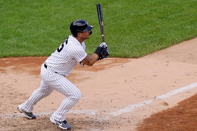 New York Yankees pinch hitter Gleyber Torres follows through on a two-run double to center field in the eighth inning of a baseball game against the Baltimore Orioles, Sunday, Sept. 13, 2020, at Yankee Stadium in New York. (AP Photo/Kathy Willens)