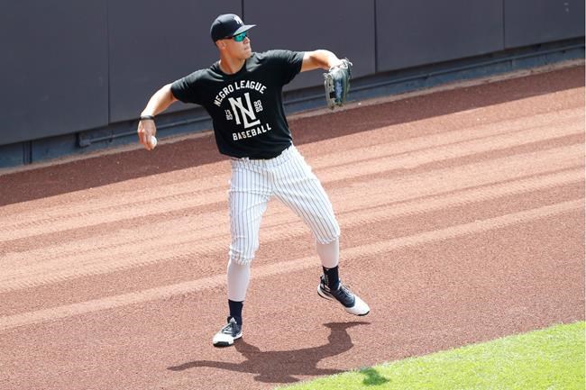 New York Yankees right fielder Aaron Judge throws from the outfield during baseball practice, Wednesday, July 15, 2020, at Yankee Stadium in New York. Judge was back on the field after suffering from a stiff neck. (AP Photo/Kathy Willens)