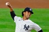 New York Yankees pitcher Deivi Garcia winds up during the first inning of the team's baseball game against the Toronto Blue Jays on Tuesday, Sept. 15, 2020, in New York. (AP Photo/Adam Hunger)