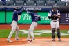 New York Yankees catcher Gary Sanchez, right, reacts as Tampa Bay Rays' Manuel Margot, center, celebrates with Austin Meadows after they scored on a two-run home run by Margot during the fourth inning of a baseball game Saturday, April 17, 2021, in New York.(AP Photo/Frank Franklin II)