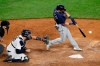 Tampa Bay Rays pinch hitter Michael Brosseau hits an RBI single during the eighth inning of a baseball game against the New York Yankees, Wednesday, Aug. 19, 2020, in New York. Yankees catcher Gary Sanchez (24) and home plate umpire Jansen Visconti are behind the plate. (AP Photo/Kathy Willens)