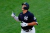 New York Yankees' Aaron Judge points skyward after hitting a solo home run during the first inning of an exhibition baseball game against the New York Mets, Sunday, July 19, 2020, at Yankee Stadium in New York. (AP Photo/Kathy Willens)